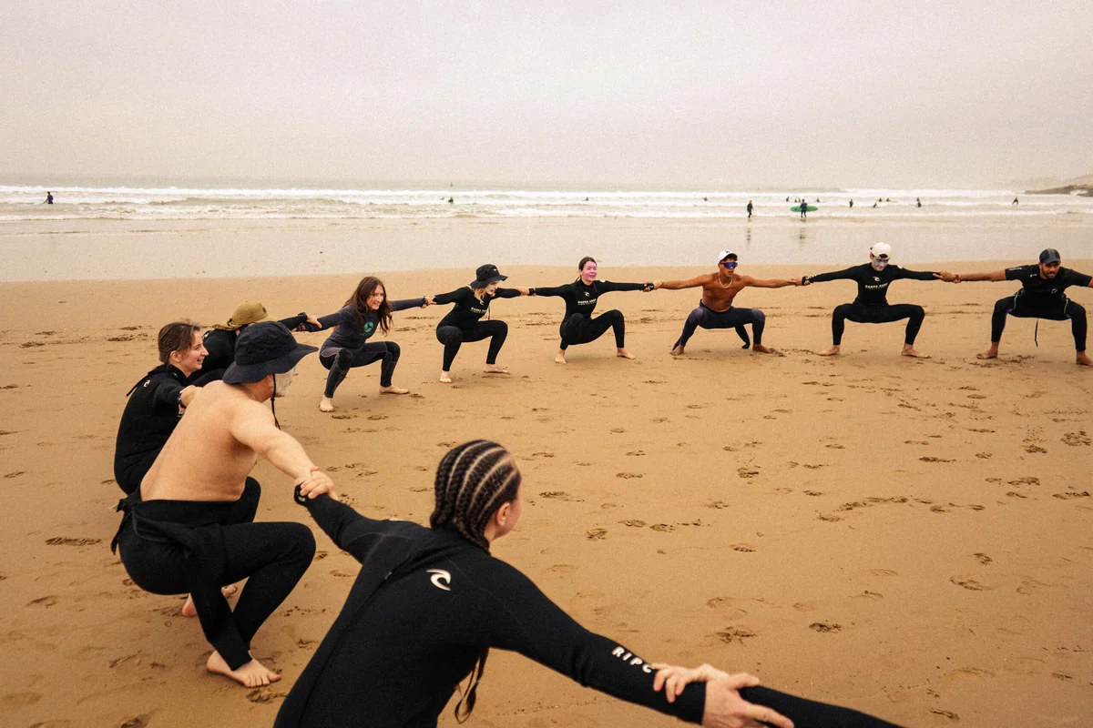 Small group surf lesson on the beach near Tamraght, Morocco