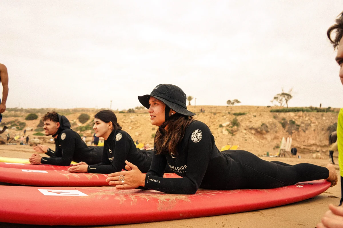 Surfers on the beach near Agadir preparing for an early morning session