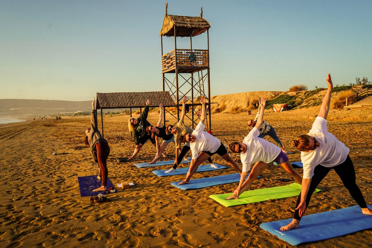 Yoga on the beach in Morocco